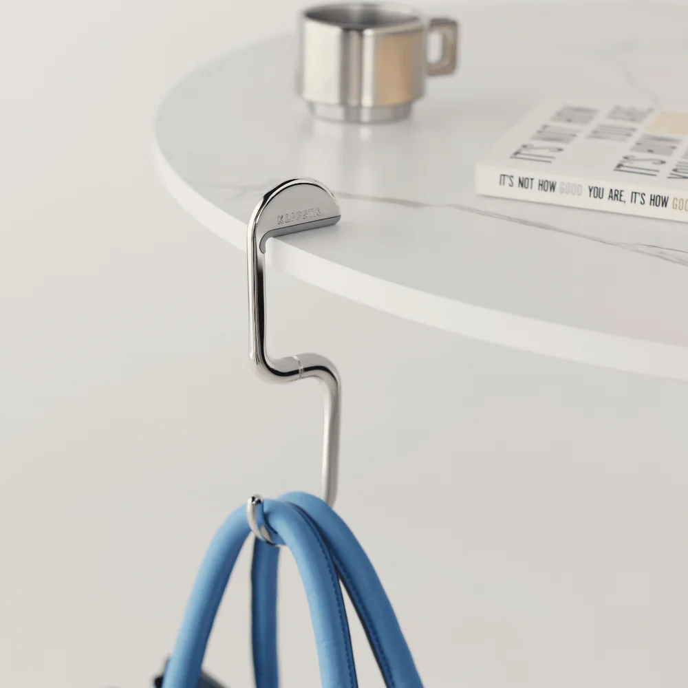 The FLIP Clip bag hook folded against a bag handle